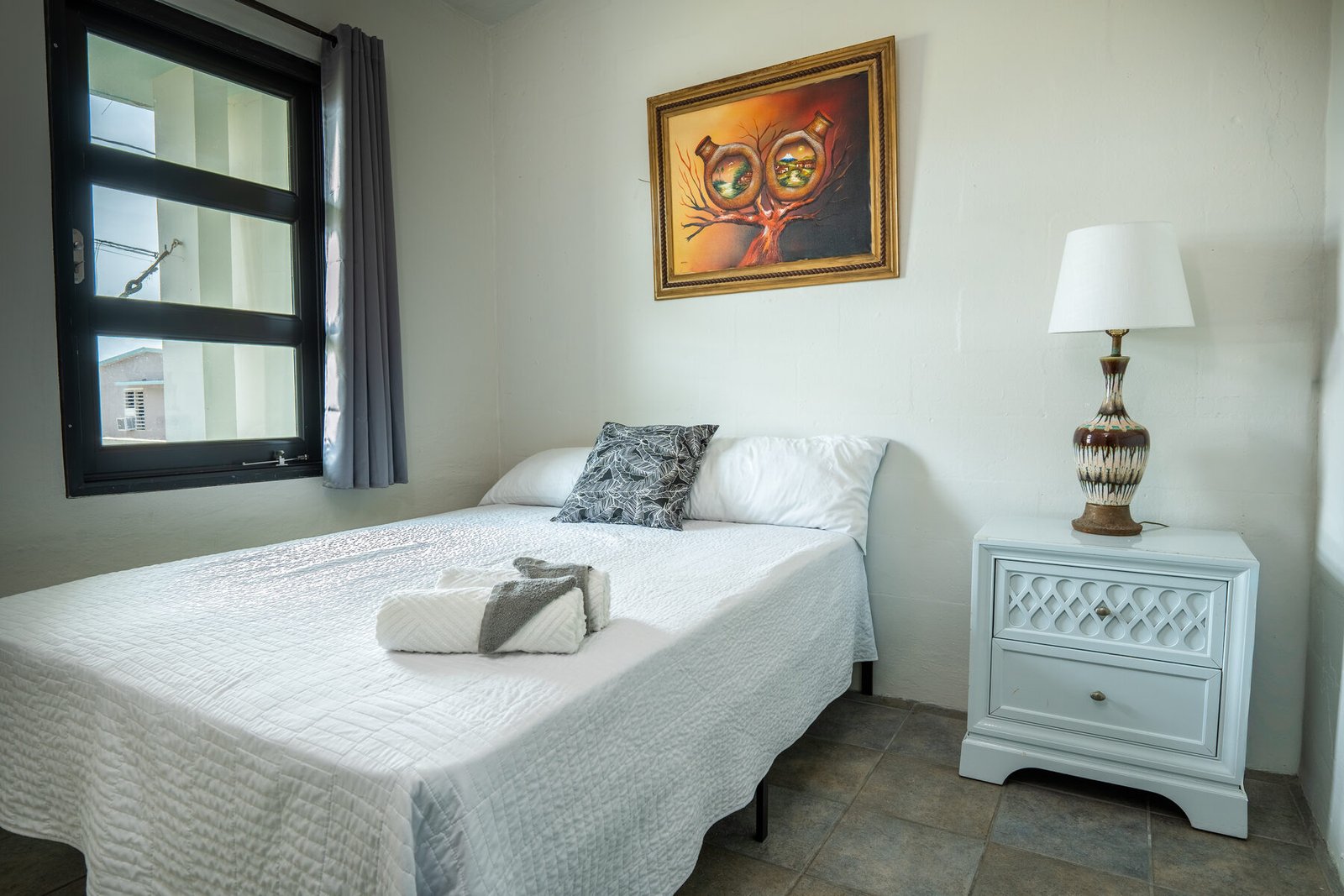 Primary bedroom with framed artwork
