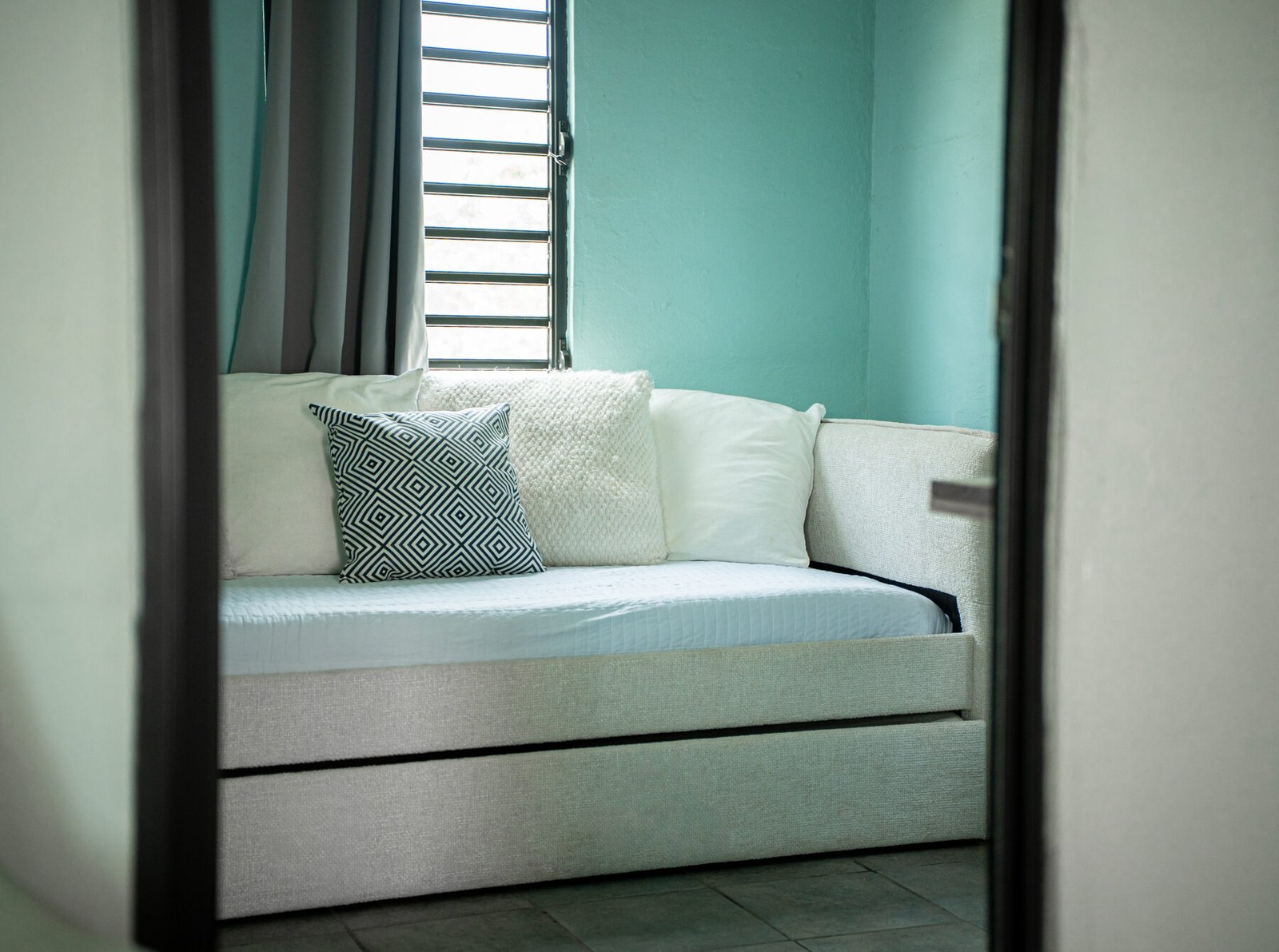 Daybed with patterned pillows