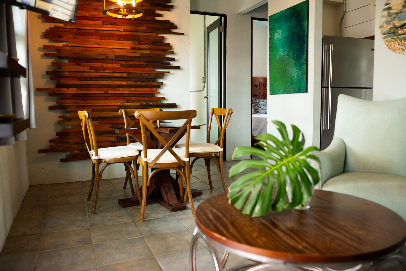 Dining table beneath the wood-slat wall