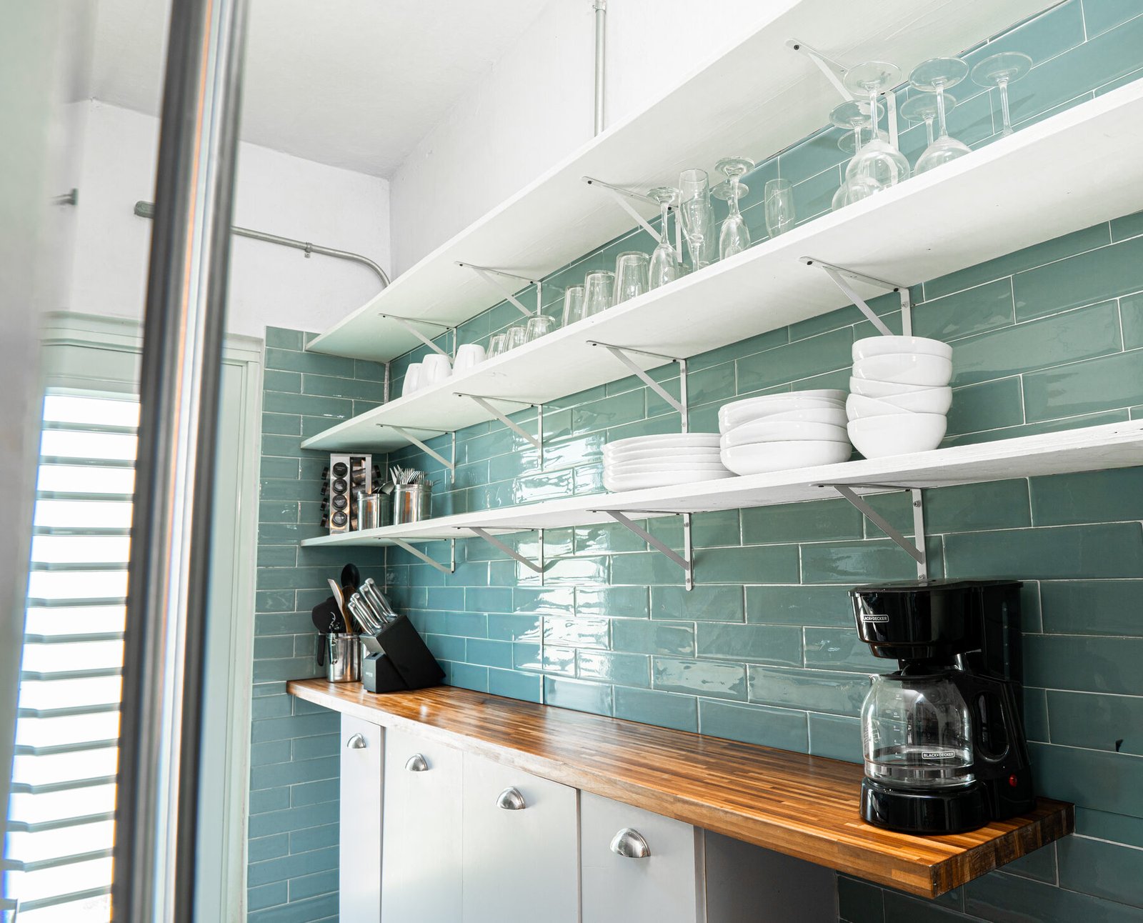 Open shelving with glassware and dishware