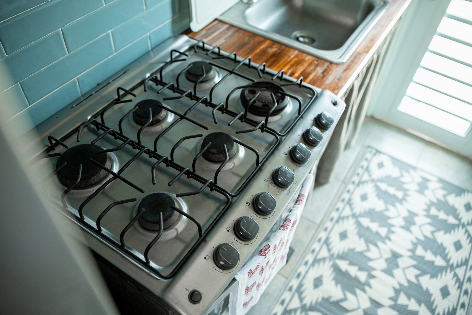 Gas range detail with wood countertop