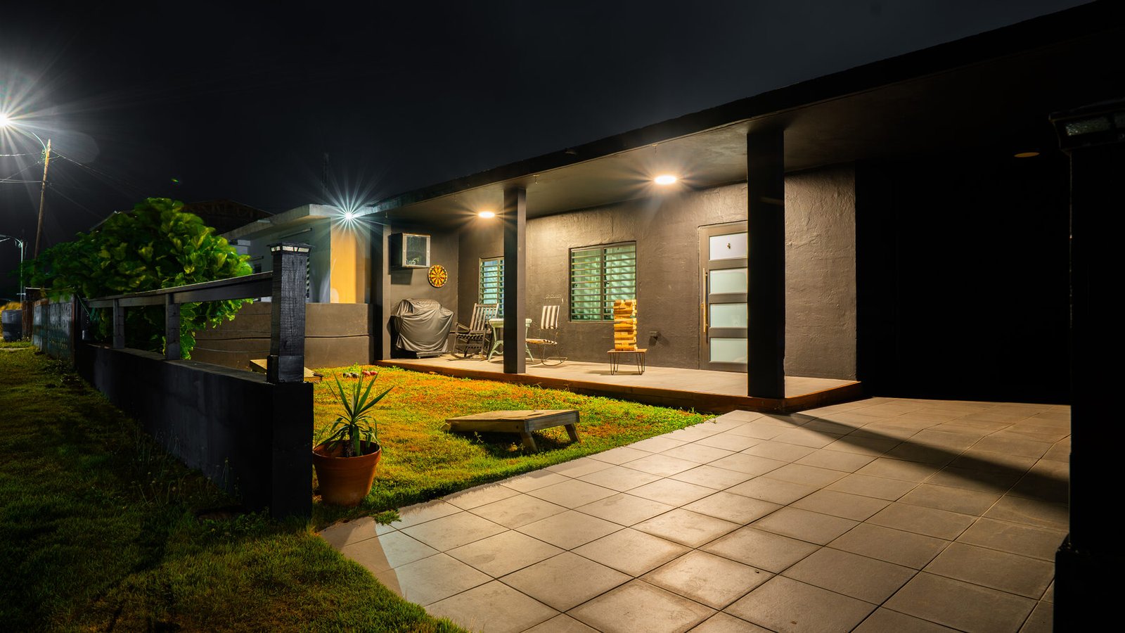 Casita Negra exterior lit up at night
