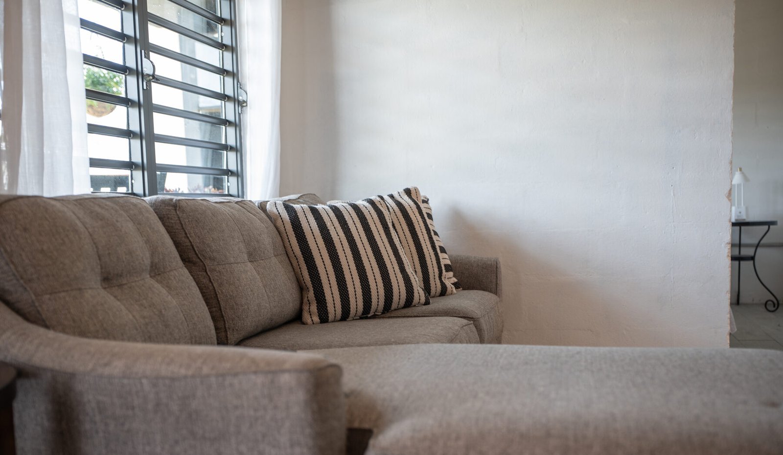 Sofa detail with striped pillow