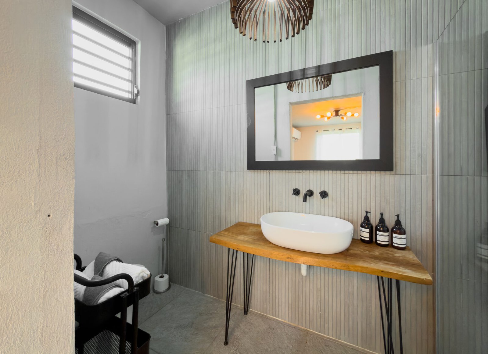 Wide view of the bathroom vanity and shower