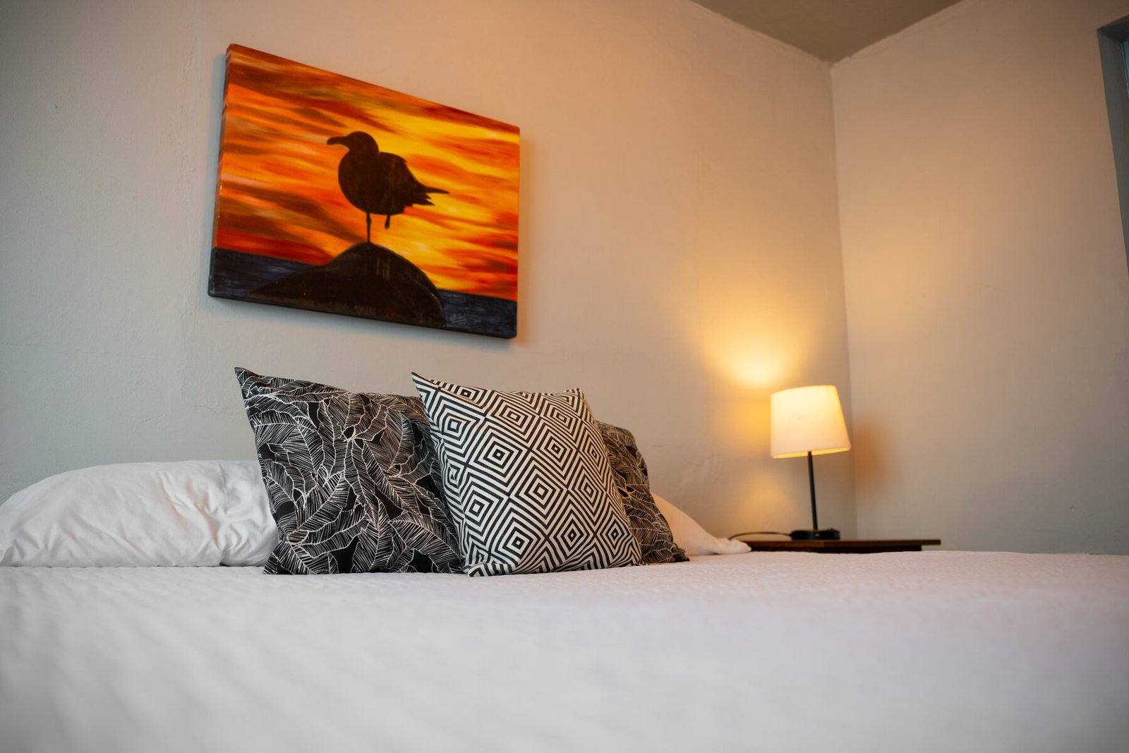 Bed detail with patterned pillows