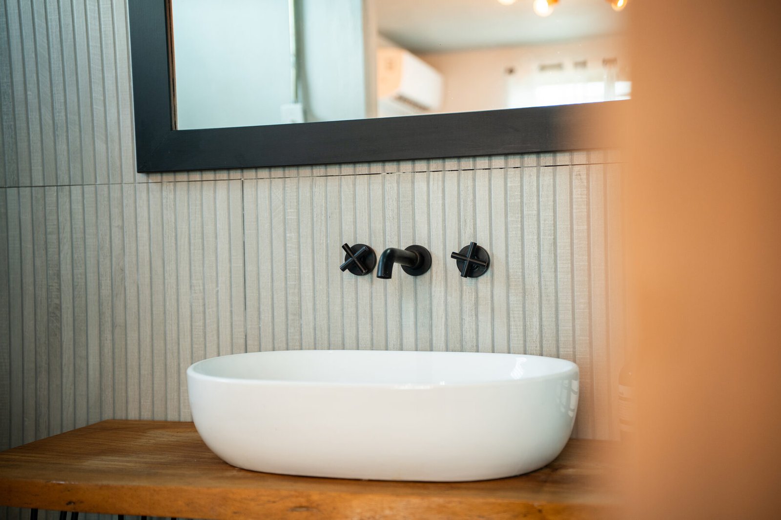 Vessel sink and matte black fixtures detail