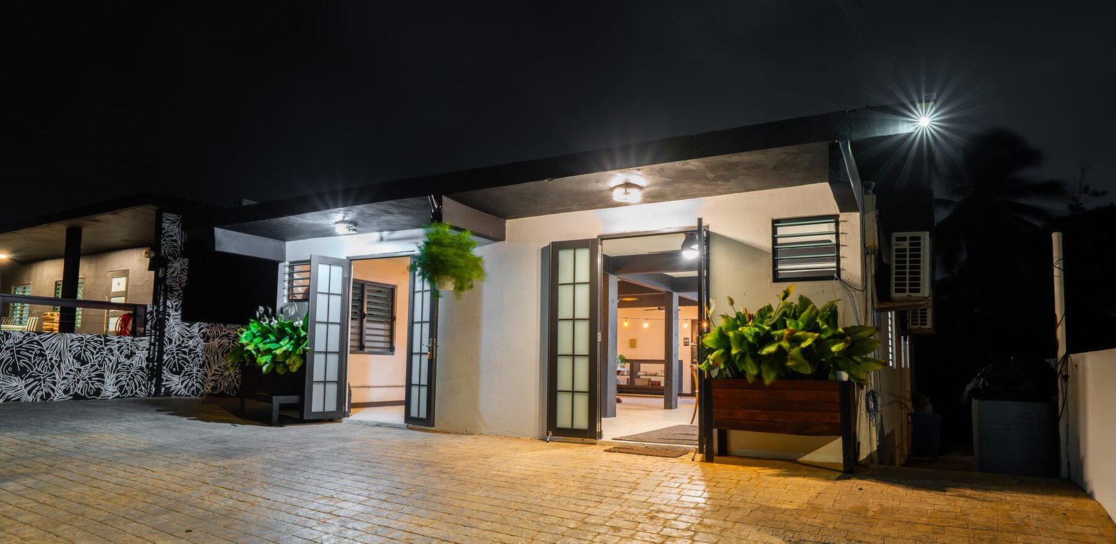 Colmado side entrance at night